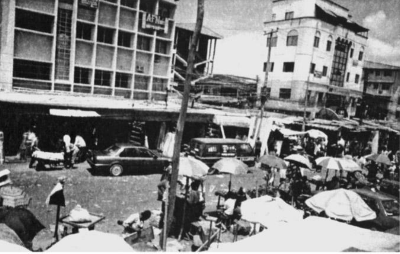 A Typical Urban Market Showing Men Occupying the Shades and Women Selling Their Petty Goods in the Open. Gloria Chuku