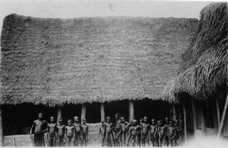 An Igbo public space for learning and recreation, likely a school, captured by Gustaf Bolinder in 1930–31.