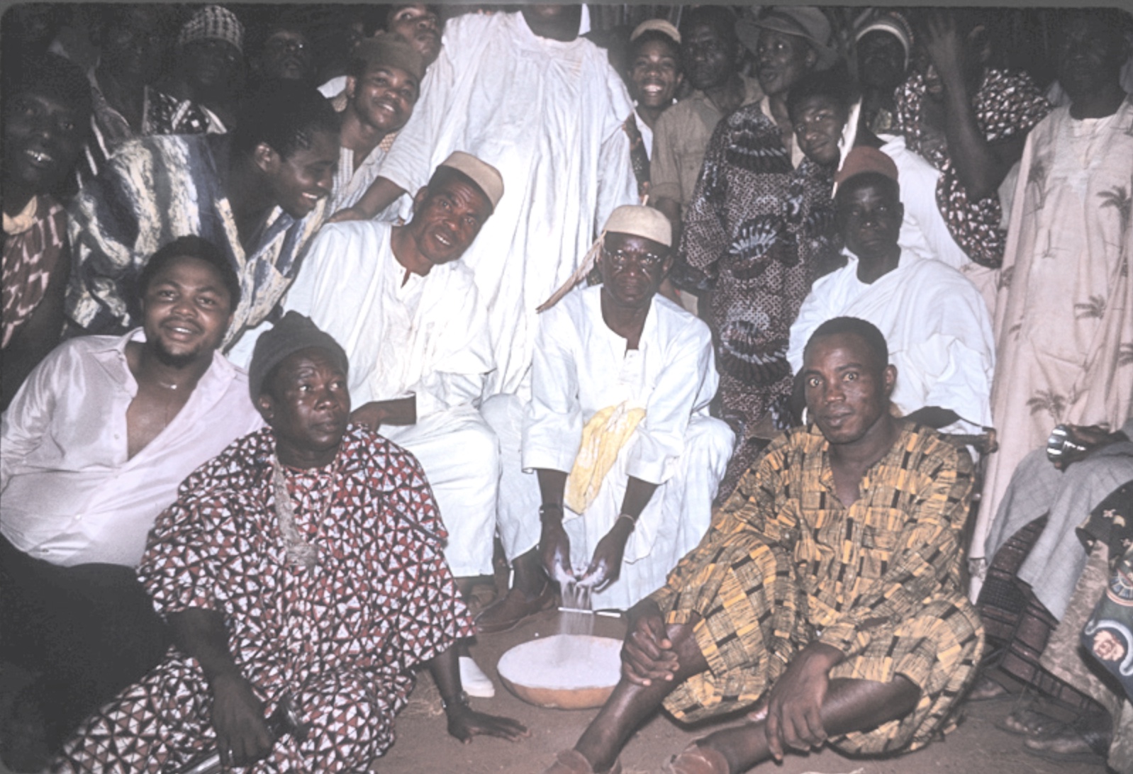 Igwe Enwezor prepares to distribute Nzu at Ije Udo, November 1961