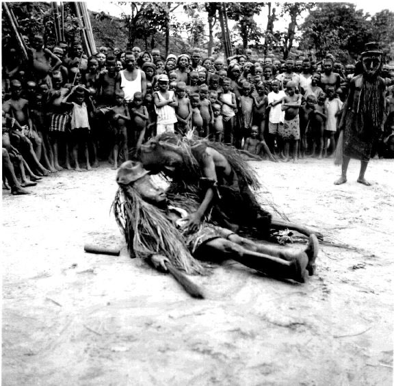 The dibia Obia revives another dibia after their battle of medicine. Photographed by G. I. Jones in the 1930s.