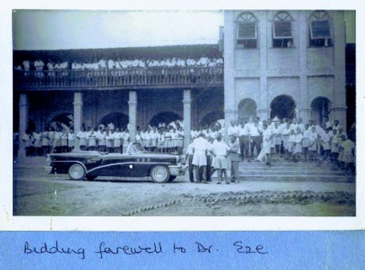 Photograph taken in 1957 at the prestigious Dennis Memorial Grammar School (DMGS), Onitsha, showing students cheering and bidding farewell to H.R.H. Igwe Captain Sir Dr Walter C. Eze (Class of 1945), the first Nigerian military medical doctor, as he prepared to return to Toronto, Canada.