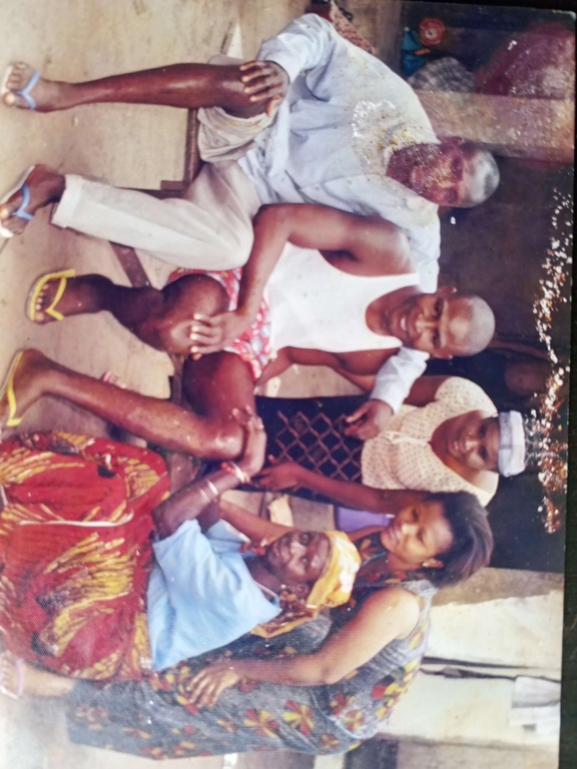 Awusigwe ogwo, a dibia okpukpu with a patient who is fully healed with a well aligned leg that has gone back to the original state in Amorka, Anambra state. Photo credit : ogwo family archives