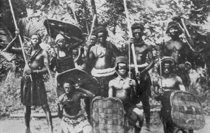 A group of Igbo warriors in ancient battle dress at a warrior's funeral. Photo: M. D. W. Jeffreys, 1956.