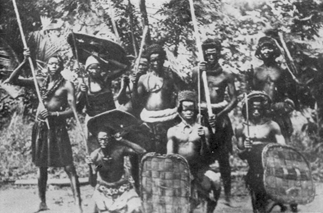 A group of Igbo warriors in ancient battle dress at a warrior's funeral. Photo: M. D. W. Jeffreys, 1956.